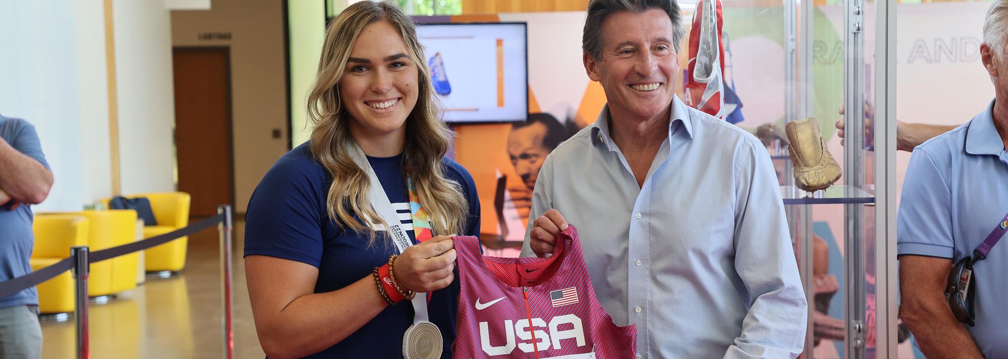 Two days after winning the world hammer title, Brooke Andersen presented the singlet and bib she wore to World Athletics President Sebastian Coe
