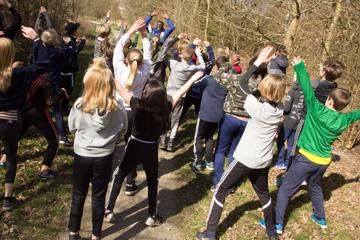 Students from the Aby Skole school in Aarhus, Denmark participate in a cross country workshop with five-time world cross country champion Paul Tergat