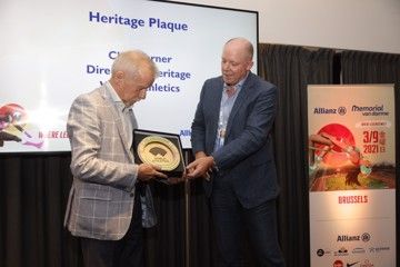 Long-time MVD meeting director Wilfried Meert receives the World Athletics Heritage Plaque from Chris Turner