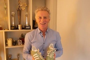 Eamonn Coghlan with his 1979 world indoor best mile shoes