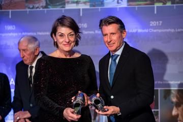 Lindsey Armstrong hands over her mother's, Diane Leather Charles, silver dipped running spikes to Seb Coe - Heritage Mile Night