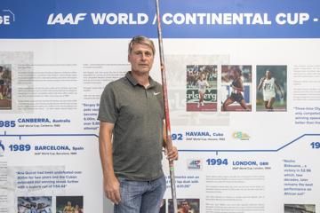Jan Zelezny with world record javelin stands next to IAAF World Cup display showing him throwing and winning in the 1992 edition in Havana, Cuba